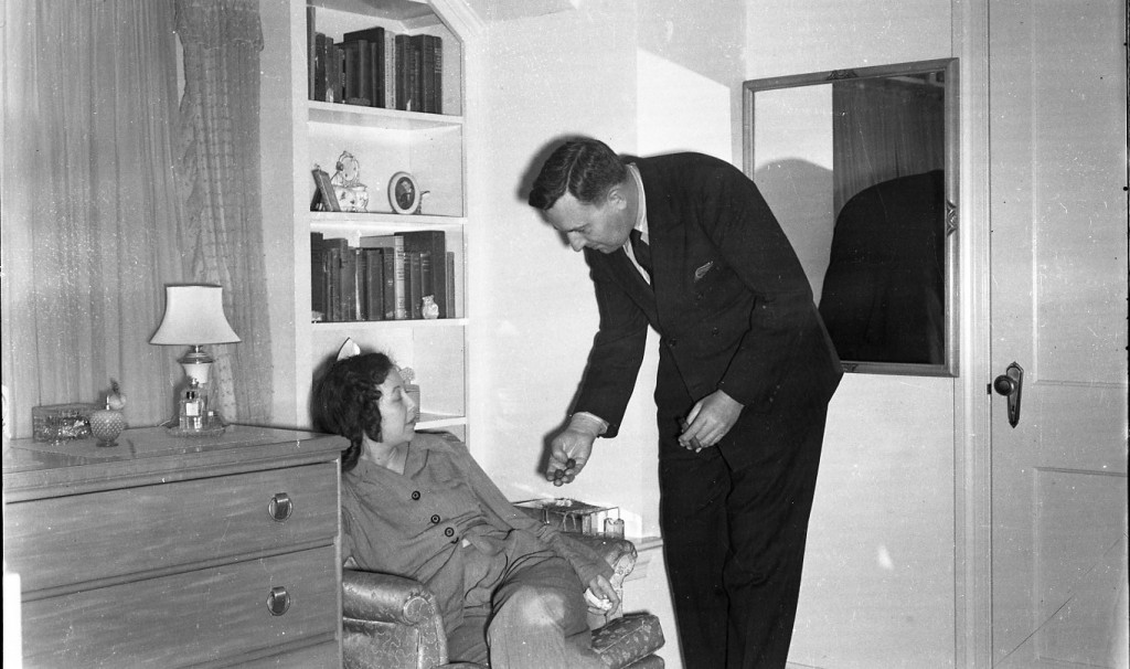 Walter talking to a guest. Note cigar.