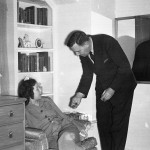 Walter talking to a guest. Note cigar.