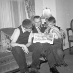 Family friend reading comics. Boys may be Walter White and Lewis Dove.